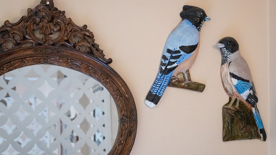 Two bird figurines on the wall at the hotel entrance at The Pavilion, Nainital