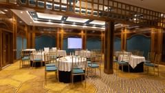 Modern conference room with round tables and projector