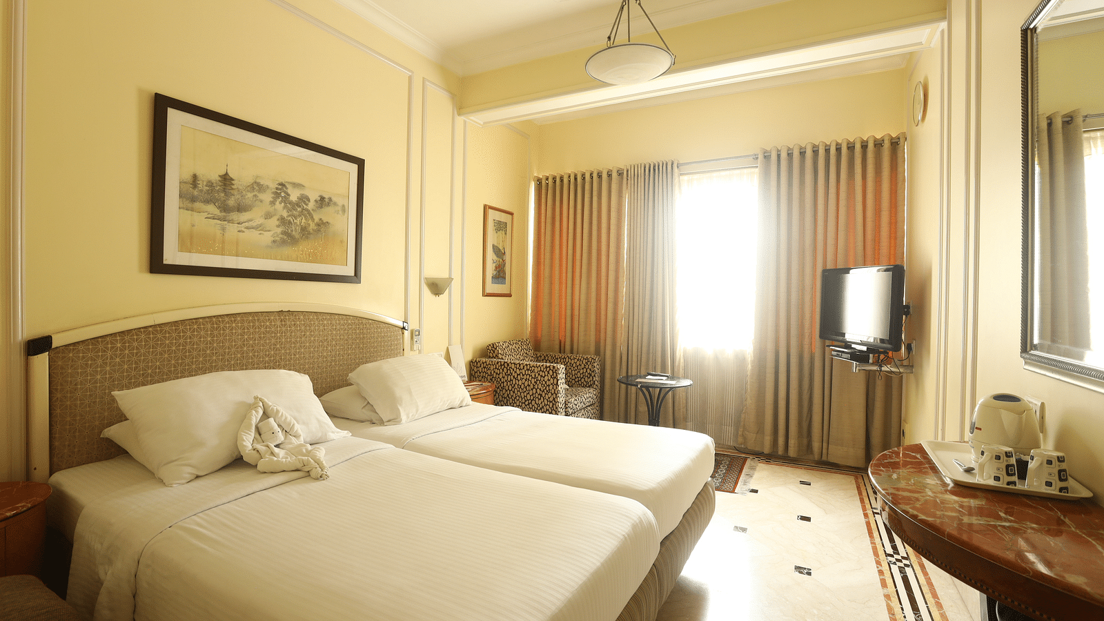 Twin beds in the Standard Room at Regency Hotel, Mumbai.