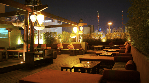 view of a rooftop restaurant at night