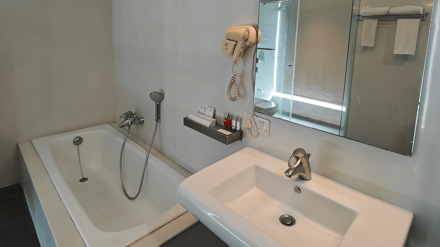 Suite room washroom with a sink and a mirror mounted on the wall at Springs Hotel & Spa