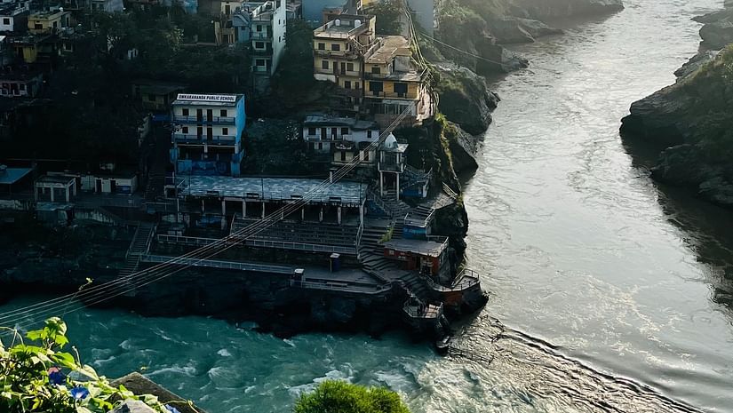 A River flowing beside a town and merging with another river - Ramgarh Bungalows, Nainital.