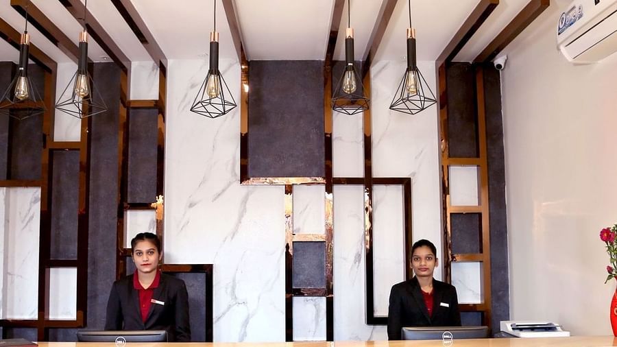 Receptionists standing at the desk at VITS Panchgani