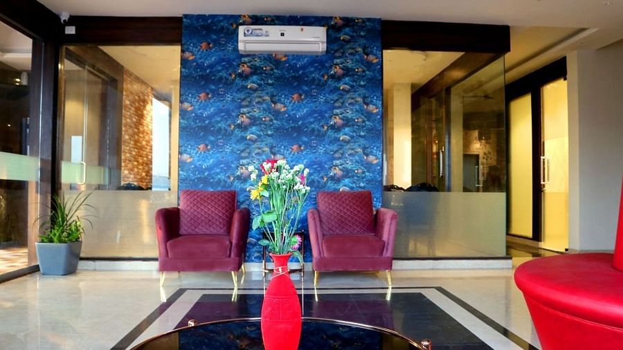 Sofa seating alongside a coffee table in the lobby of VITS Panchgani