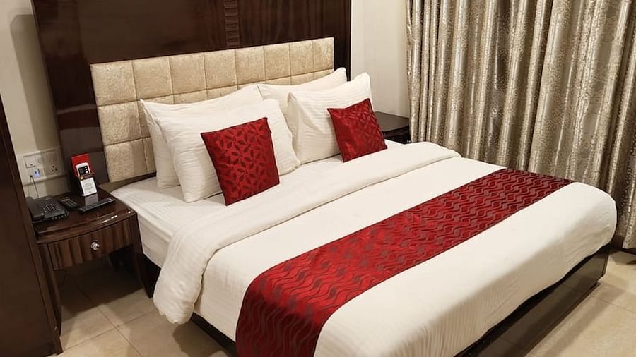 A double bed in the Deluxe Room at VITS Panchgani