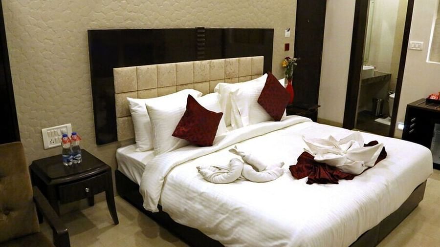The suite at VITS Panchgani with a double bed and side tables