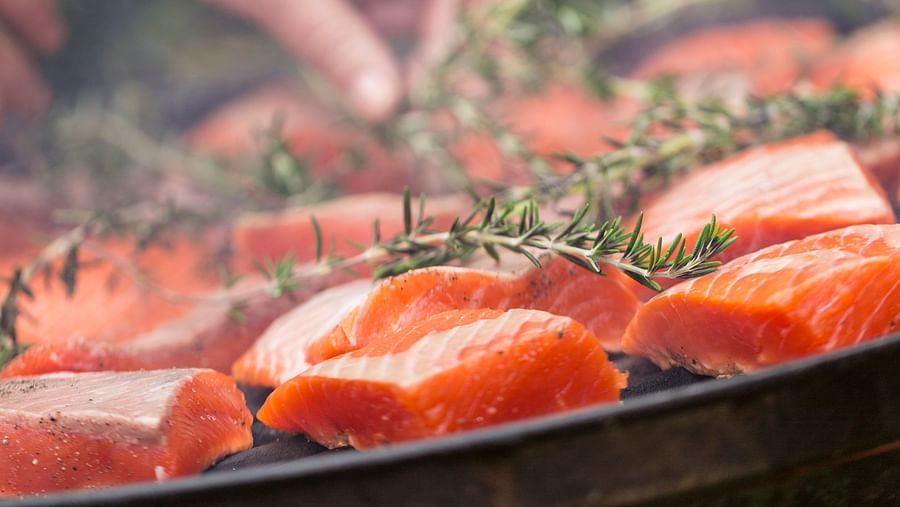 A close up of Salmon being grilled in the open - Brewery Gulch Inn & Spa