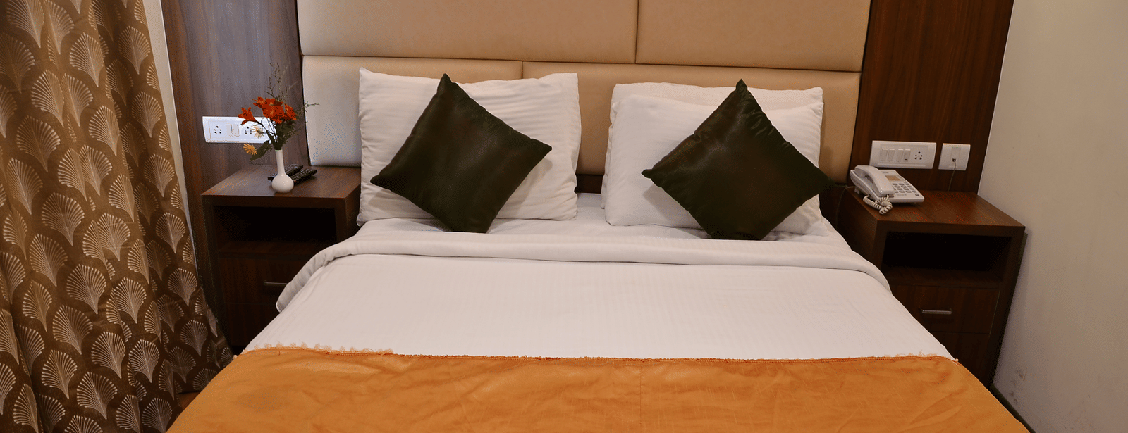 A comfortable bedroom with soft lighting, plush pillows, and a warm colour scheme for restful nights - Benzz Park, Kodaikanal