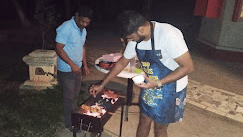 Guests enjoying a barbecue experience at Fantasy Golf Resort, Bangalore in a cozy outdoor setup.