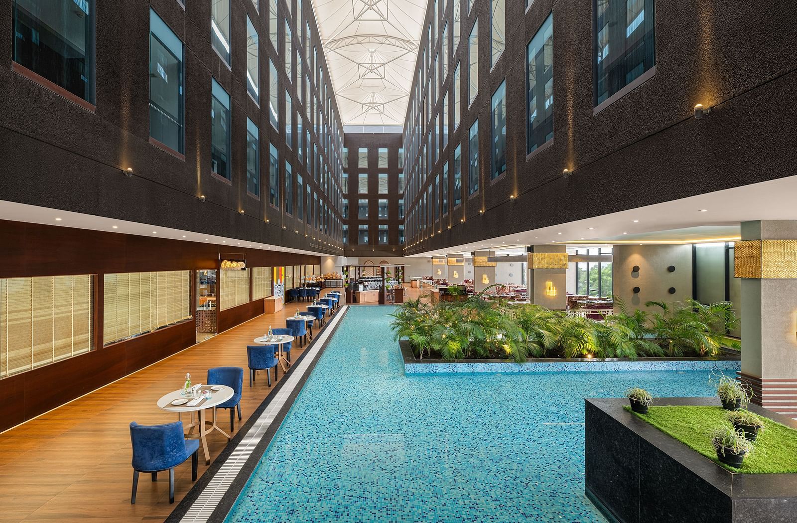 Blue Salt Cafe at Essentia Luxury Hotel, Indore with poolside seating arrangement
