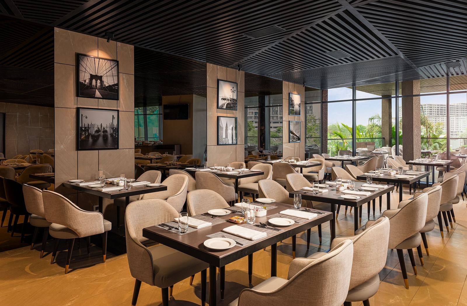 A view of dining area at Citron Bar with comfortable seating at Essentia Premiere, Pune.