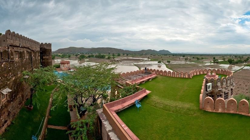 A long shot of the resort premises under a cloudy sky