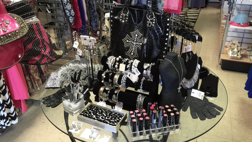 Jewellery and cosmetics laid down on a table