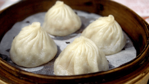 Dumplings served in a bamboo container