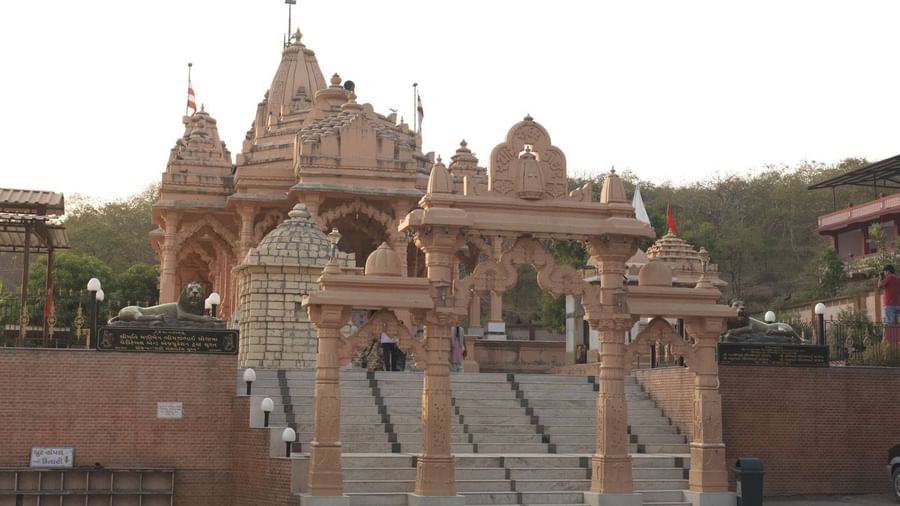 Tulshishyam temple with its intricate architecture and a red religious flag on top of the dome.