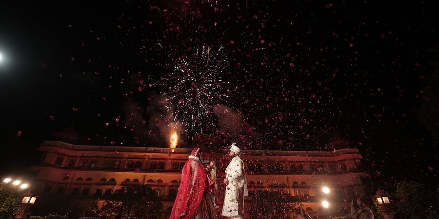 Advait & Akshay under a sky full of fireworks during their wedding night at Umaid Palace.