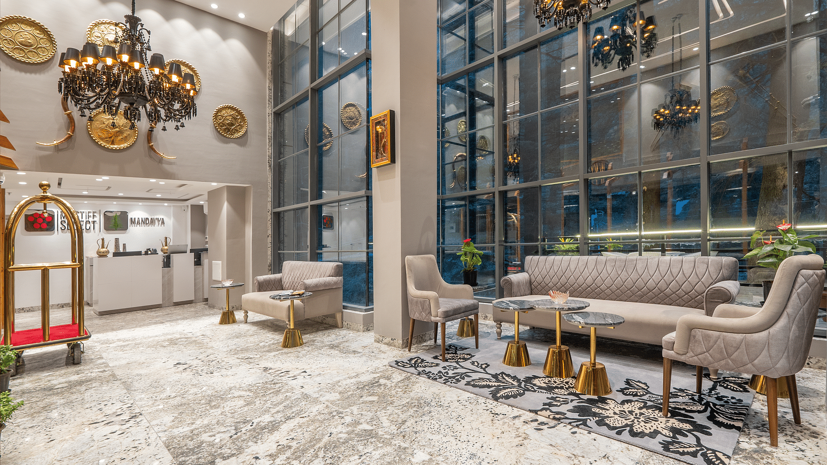 an image of lobby area with sofas and front desk