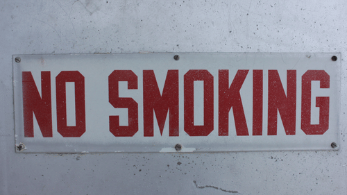 No smoking sign displayed on a hotel wall.