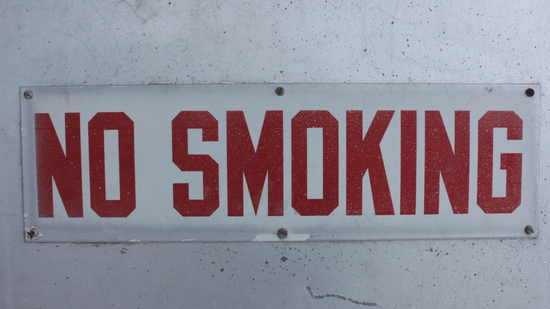 No smoking sign displayed on a hotel wall.