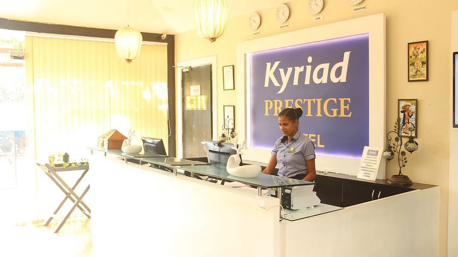 Woman standing at the Reception at Kyriad Prestige Calangute, Goa