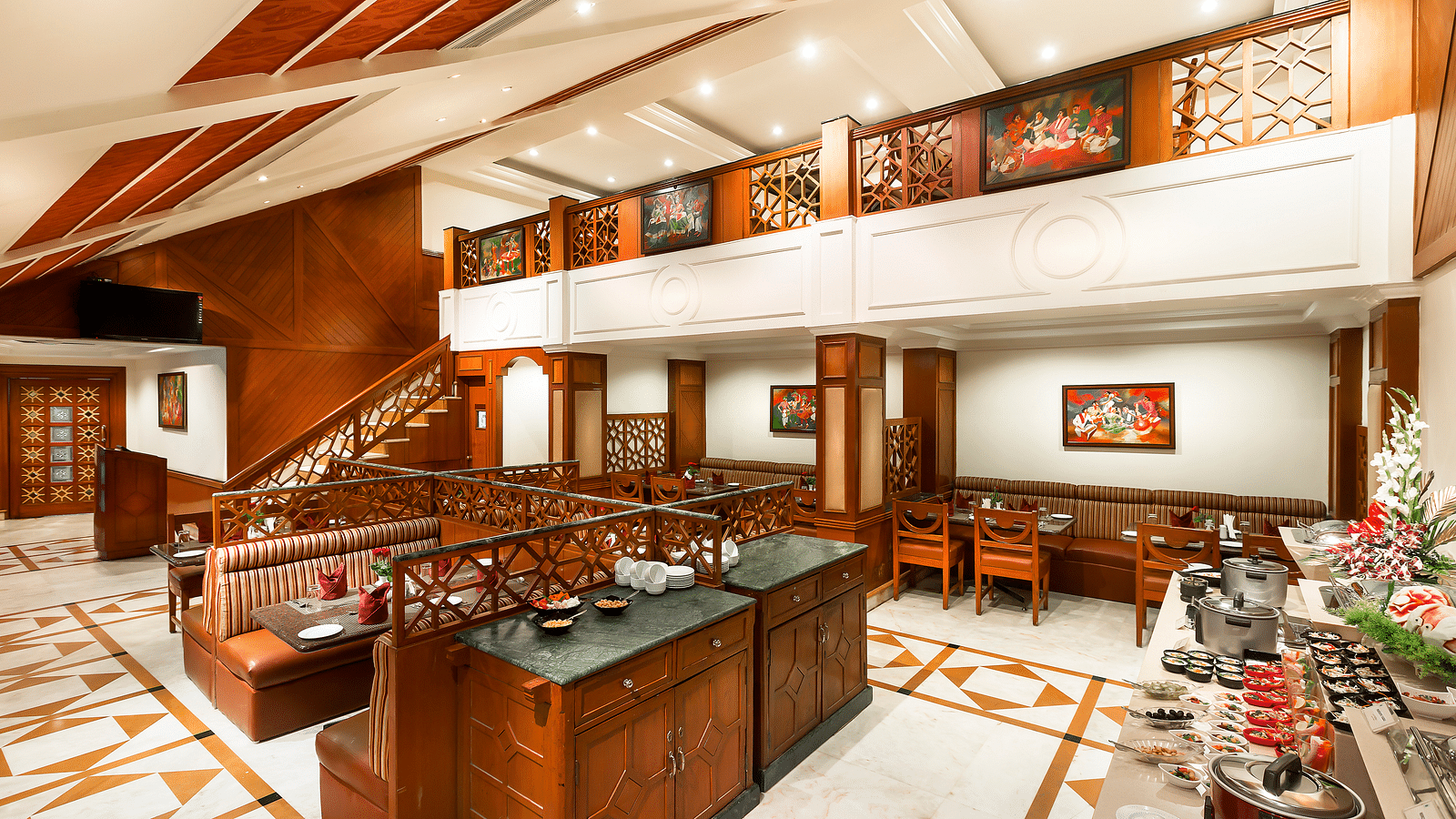 A seating arrangement of Dakshin Restaurant at Regency Kanchipuram by GRT Hotels.