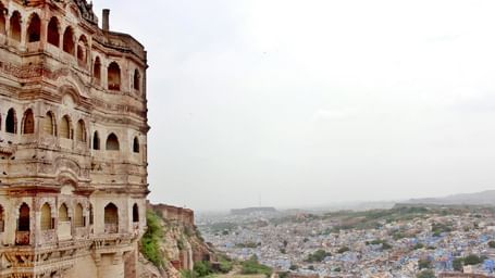A partial view of Mehrangarh Fort’s facade overlooking the cityscape of Jodhpur, one of the top Jodhpur tourist attractions.