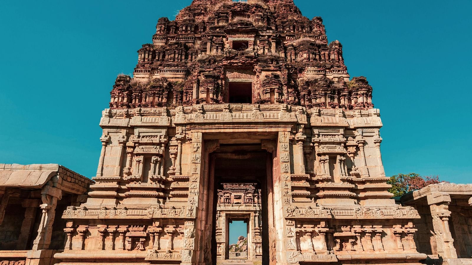 An overview of an ancient temple with blue sky in the background
