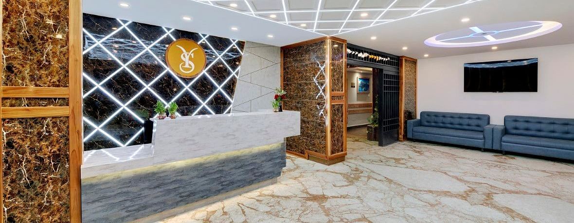 An image of the lobby at Yashshree Sikkim Blossom, Gangtok featuring the seating area with sofa sets and the reception