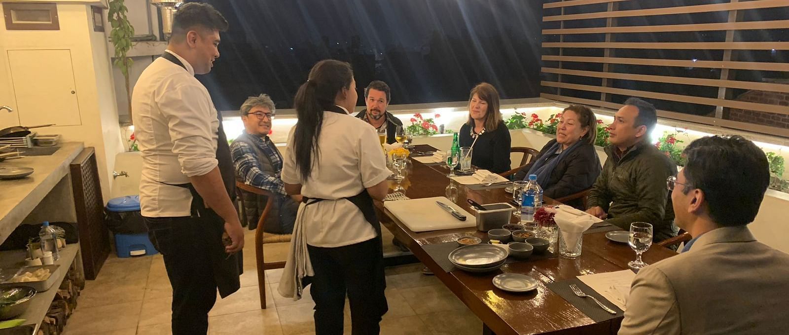 A group of people gathered for the chefs table dinner