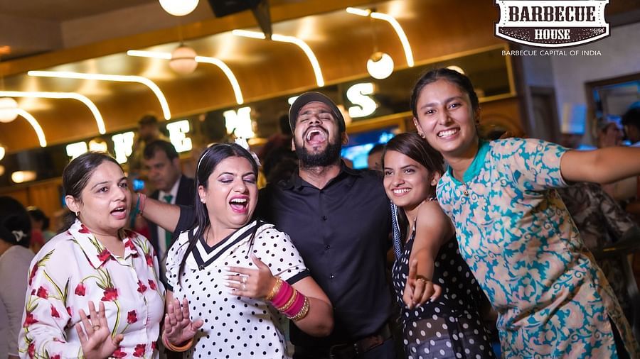 An image of a group posing at Themis Barbecue House, Panipat