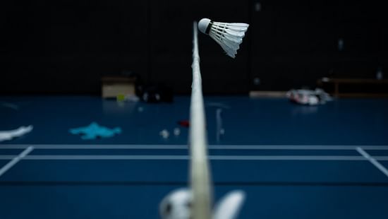 a badminton shuttle over the net