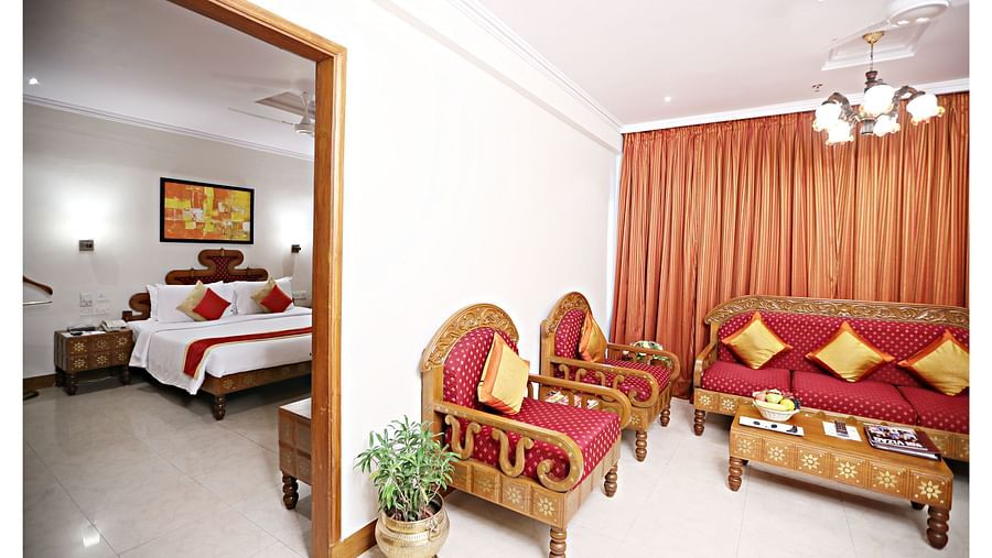the living space with a sofa set and centre table at Deluxe suites in Vizag 3