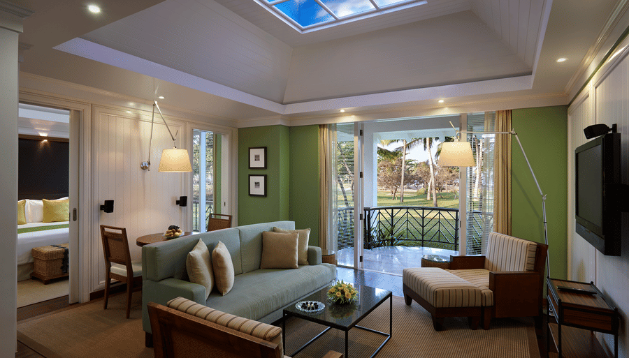 overview of the living room with sofas and table inside Presidential Villa - Caravela Beach Resort Goa