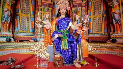 An overview of a temple with the idol of Durga Maa in the centre