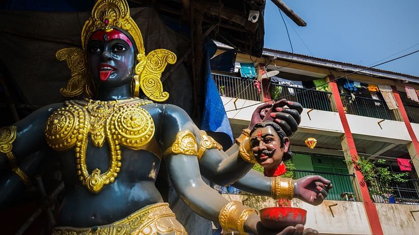 an image of the statue of goddess kali adored with gold jewels