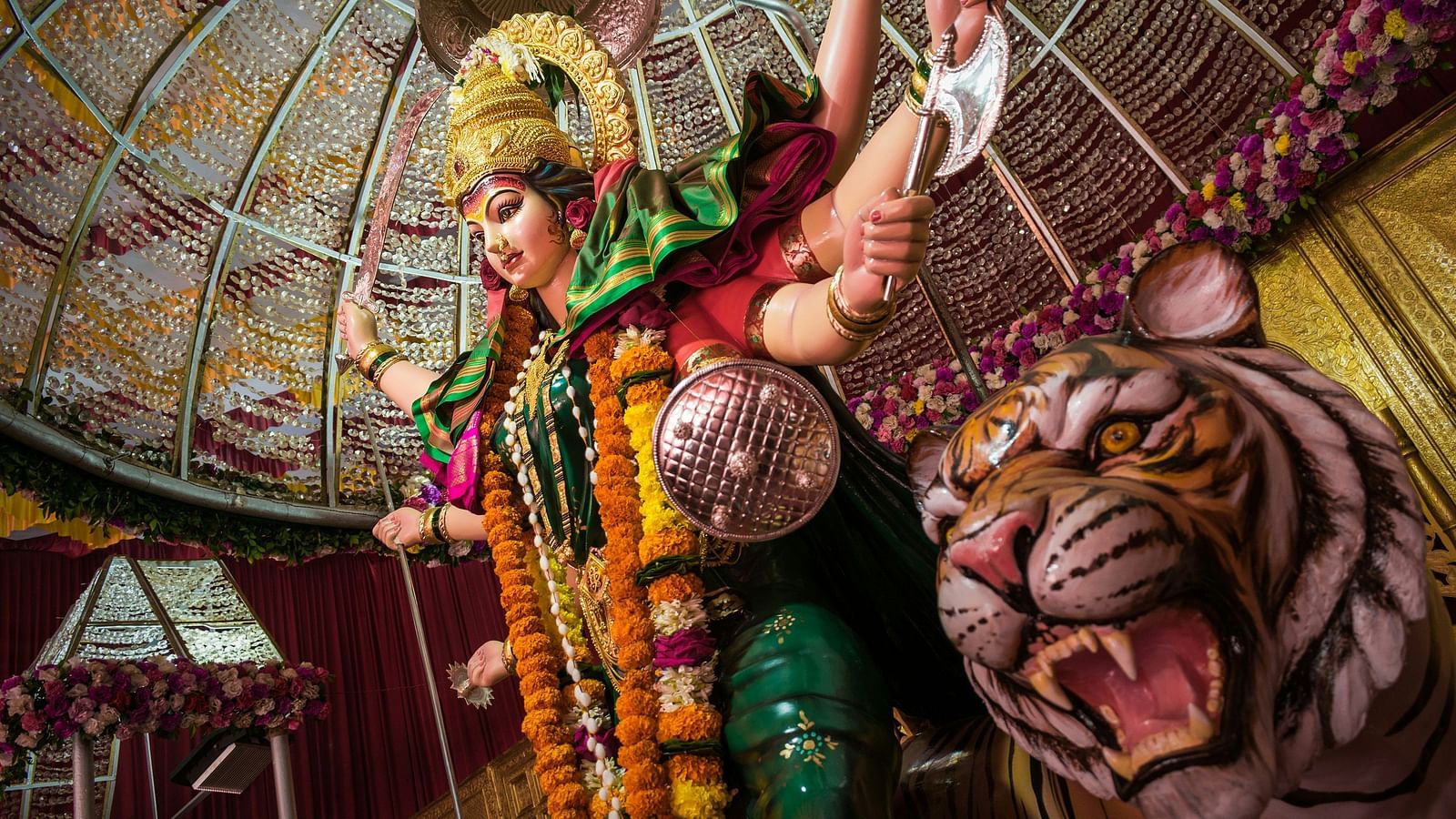 an idol of Indian goddess with a tiger 