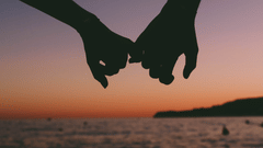 Couple holding hands during the sunset in Goa near the beach