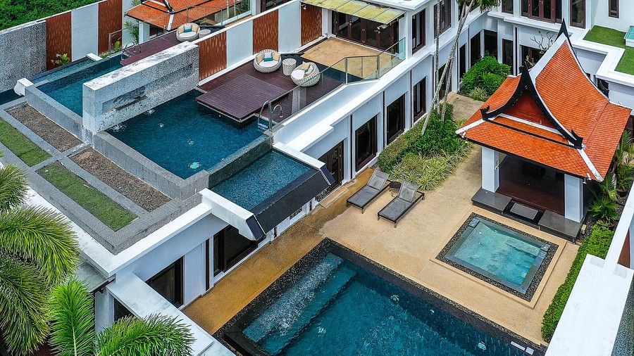aerial view image of the villas with swimming pool nestled amidst tropical greenery