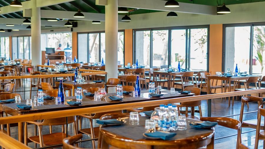 Wide view of the main dining space inside Song of the Sea restaurant.
