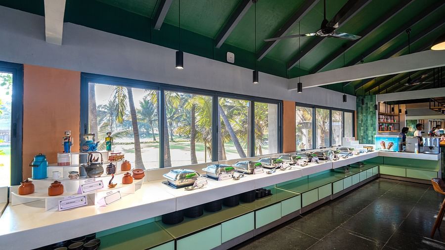 Buffet counter and seating at Song of the Sea restaurant with large windows.