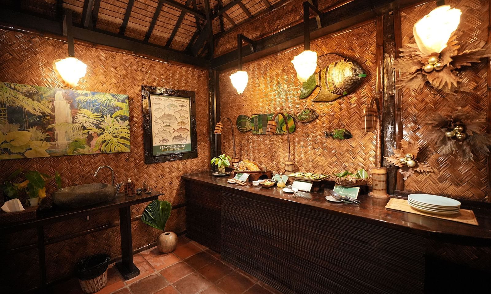 Buffet counter with wooden interior and hanging lamps inside Flower Island Resort.