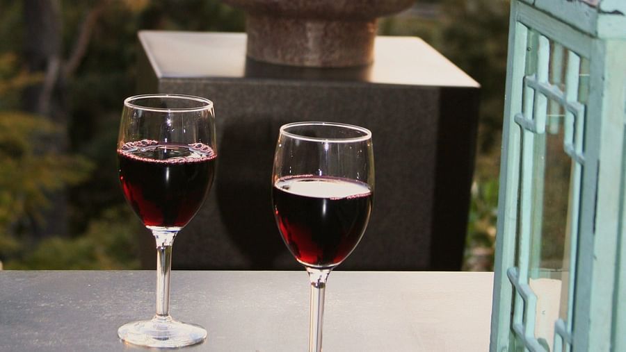A romantic sunset view with wine glasses on a table - Brewery Gulch Inn & Spa