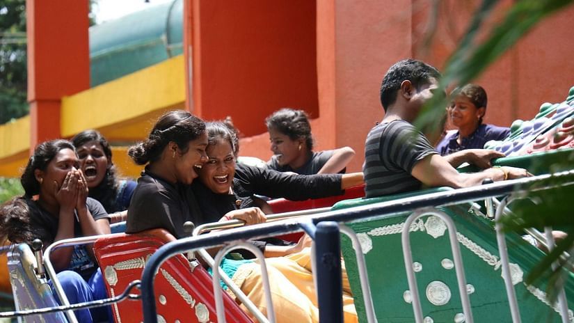People enjoying an exciting ride at Black Thunder amusement park