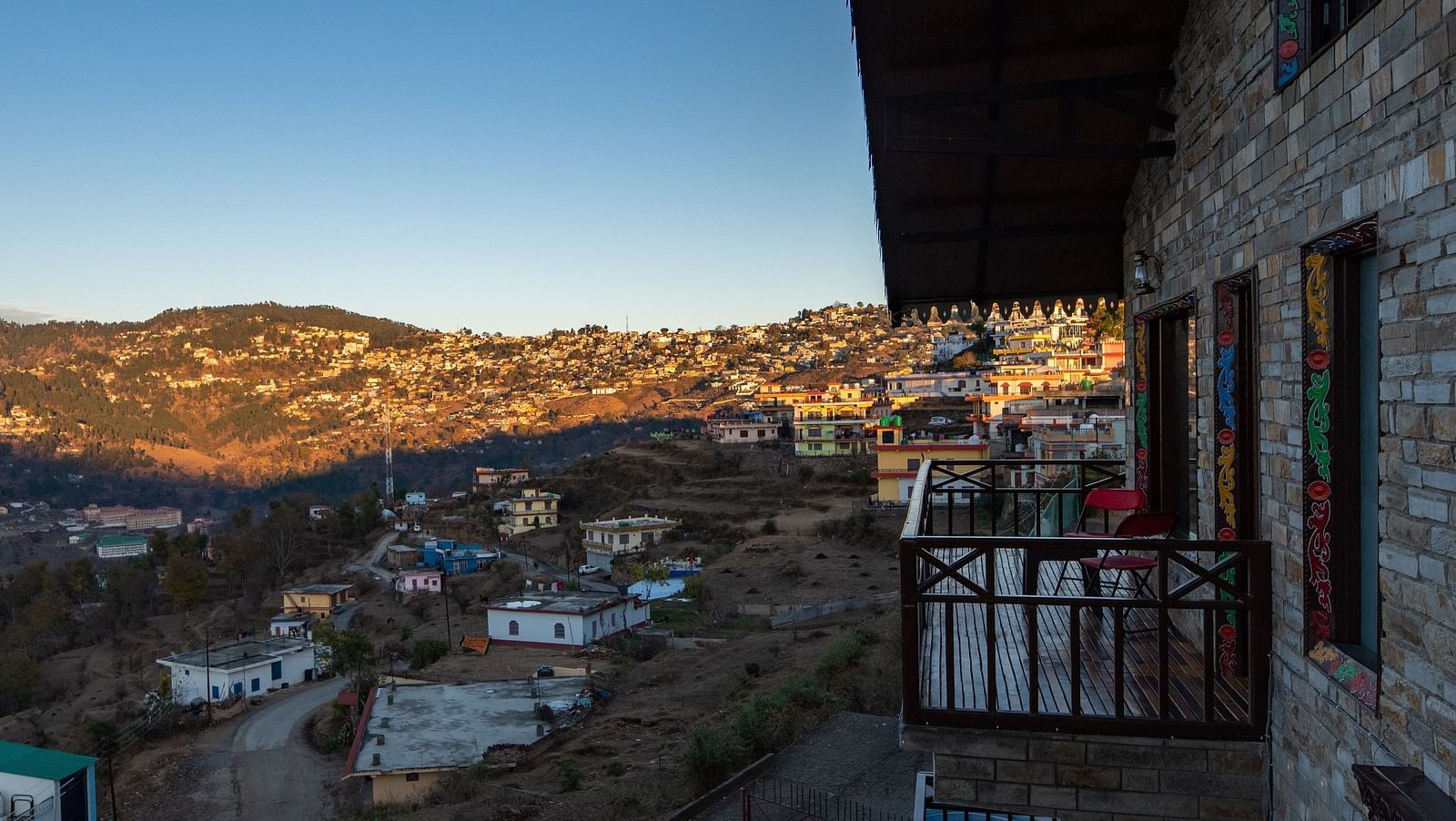 A charming homestay surrounded by lush greenery and set against the backdrop of rolling hills and blue skies. - Blusalzz Homes The Himalayan Bungalow, Almora
