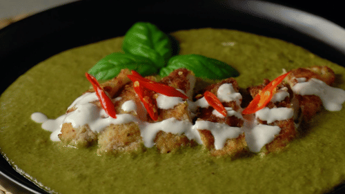 green chilli curry garnished on top