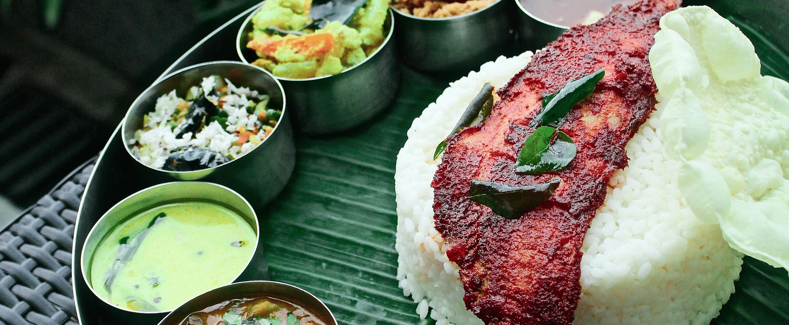 An image of a South Indian thali spread out with different dishes
