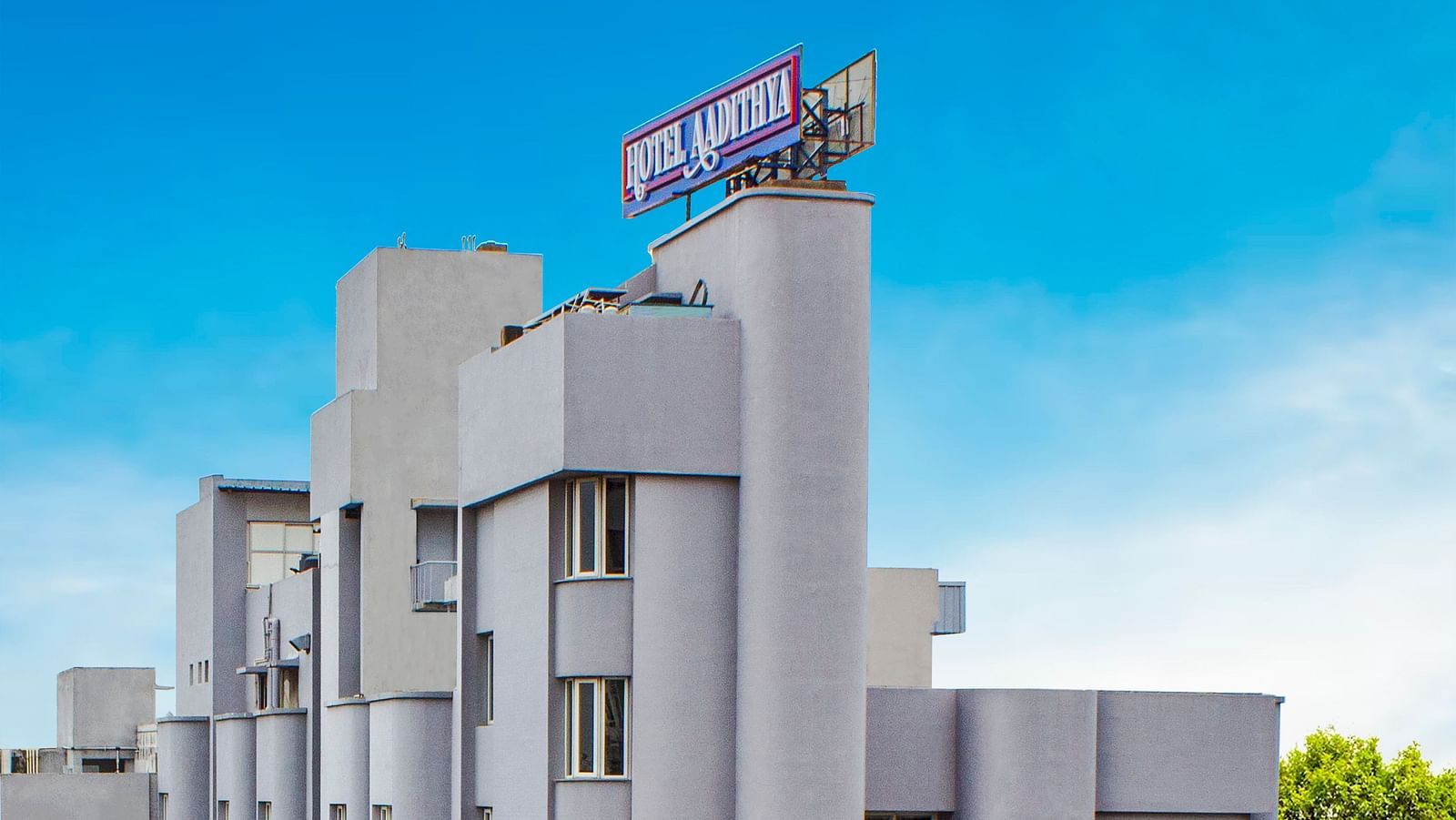 A bright morning view of the facade of Hotel Aadithya, Chennai