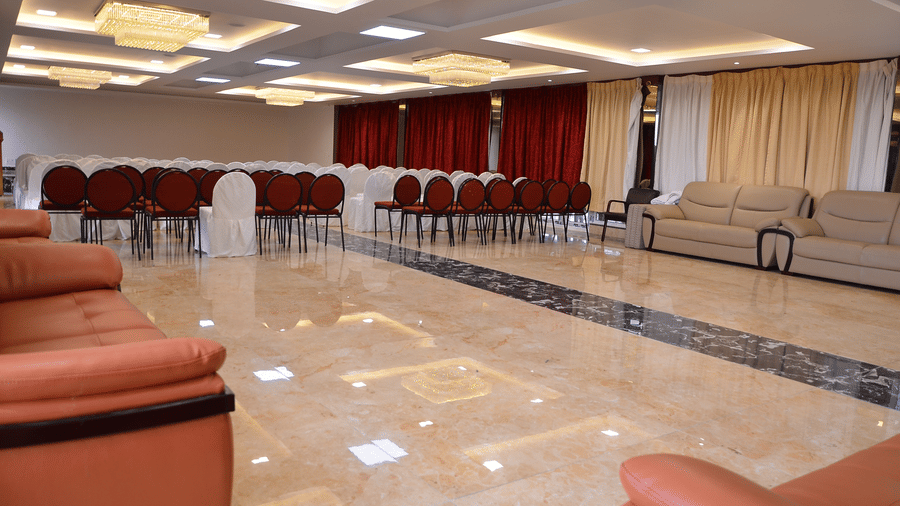 Spacious banquet hall with elegant lighting and comfortable seating, ideal for events and functions - Benzz Park, Kodaikanal