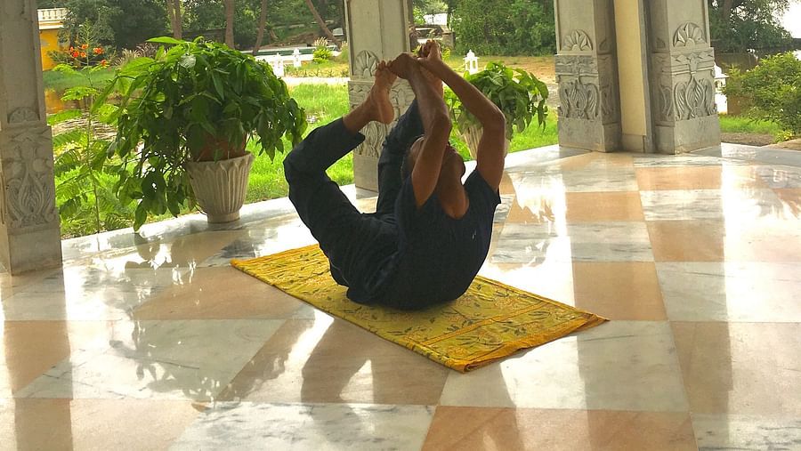 A person performing yoga - Dev Shree, Deogarh
