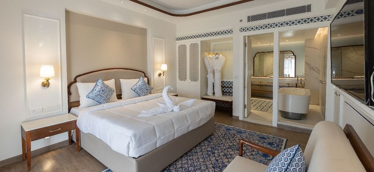 Full view shot of the luxurious bedroom at Ananta with ample of natural lighting at Bhagirathi by RDB Atishay.